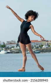 Front view of ballet dancer practicing on street in Panama city, Central America