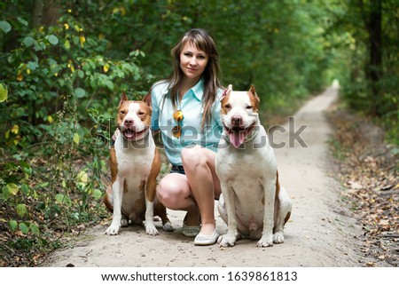 Similar – Image, Stock Photo Attractive womanon a rural path with dogs at sunset