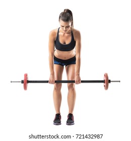 Front View Of Bent Female Athlete Doing Dead Lift Exercise With Barbell Looking Down. Full Body Length Portrait Isolated On White Studio Background. 