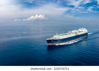 Front view of a big LNG tanker ship travelling over the calm, blue ocean as a concept for international fuel industry with copy space - Shutterstock ID 2210715711