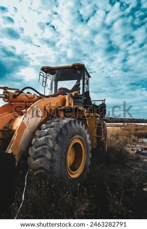 Front view of big rusty bucket of old huge heavy crawler bulldozer, abandoned vintage earthmover dozer, industrial heavy machinery