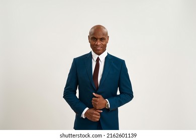 Front view of black confident businessman looking at camera. Bald adult man wearing formal wear. Concept of modern successful male lifestyle. Isolated on white background. Studio shoot. Copy space - Shutterstock ID 2162601139