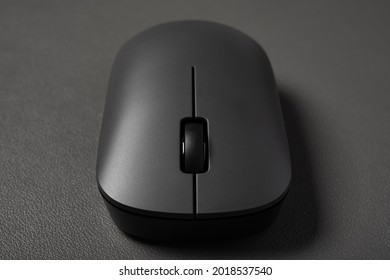 Front View Black Wireless Mouse On A Dark Background