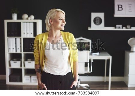 Front view of blond woman in office