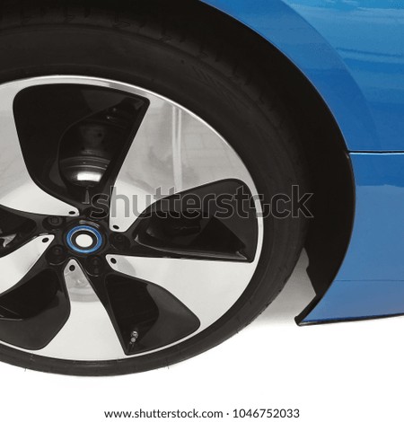 Front View Of Bright Blue Sports Car, Focus On Tire, Close up