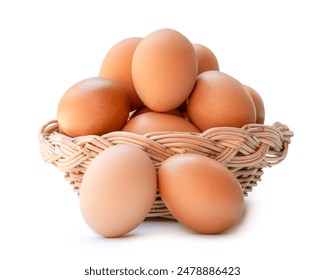 Front view of brown chicken eggs in stack in wicker basket is isolated on white background with clipping path. - Powered by Shutterstock