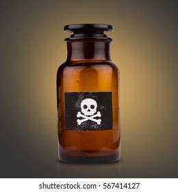 Front View Of Brown Medical Glassware With Glass Cap And The Poison Sign Label On Dark Background