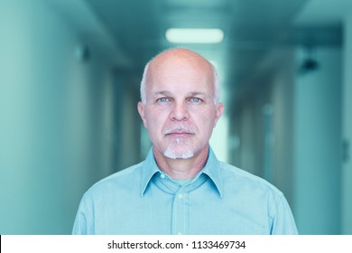 Front View Of Business Man Looking Stoic And Facing The Camera.