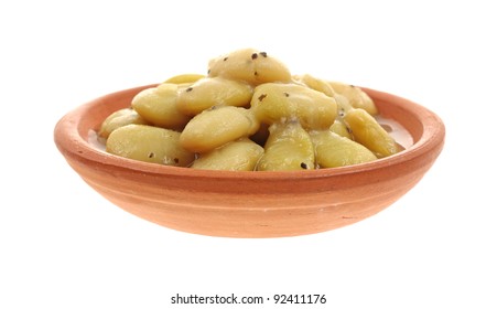 A Front View Of Canned Lima Beans In Pottery Bowl.