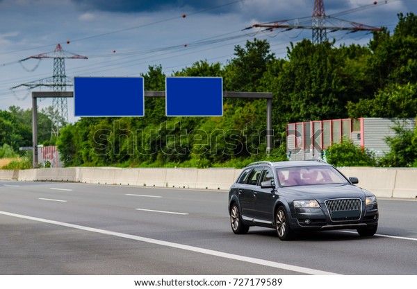 Front view of\
the car driving on german autobahn\

