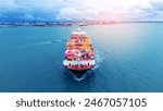 Front view of  Cargo container ship carrying container and running out international container port customs shipyard sea port concept smart logistic service. 