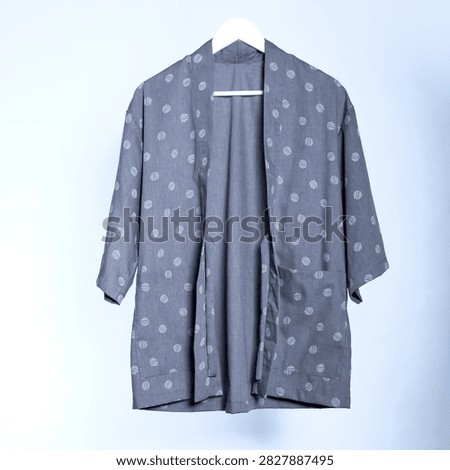 Front view of a casual grey patterned haori jacket on a hanger.