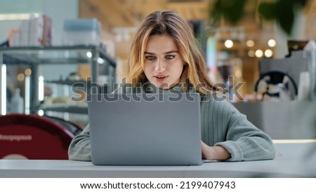 Front view caucasian busy focused woman girl freelancer worker user smm specialist marketer working laptop typing drinking coffee in cafe online business e-commerce e-learning businesswoman chatting