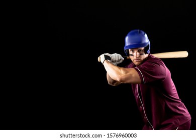 Front View Of A Caucasian Male Baseball Player, A Hitter, Wearing A Team Uniform And A Helmet, Stripes Of Eye Black Under His Eyes, Ready To Swing A Baseball Bat 