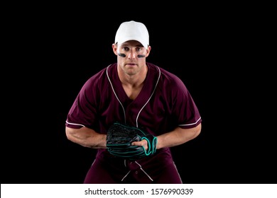 Front View Of A Caucasian Male Baseball Player, A Fielder, Wearing A Team Uniform, Baseball Cap And A Mitt, Waiting For A Hit To Catch, With Stripes Of Eye Black Under His Eyes