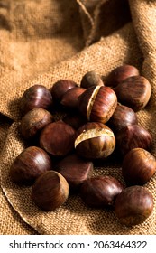 Front view of chestnuts on rustic background 