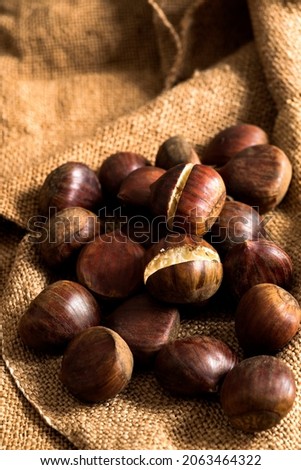 Front view of chestnuts on rustic background 