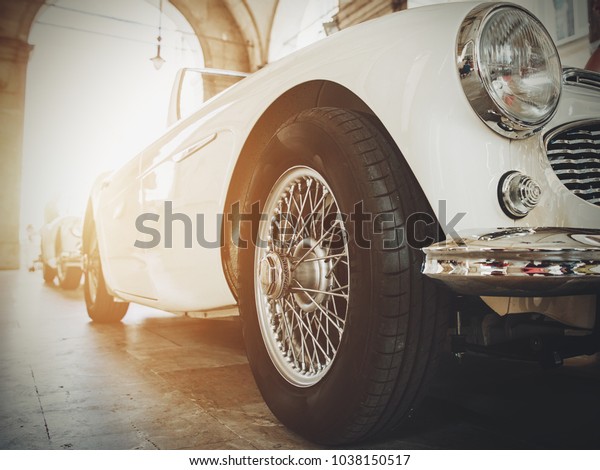 Front view of classic vintage car. Retro toned
postcard, poster.