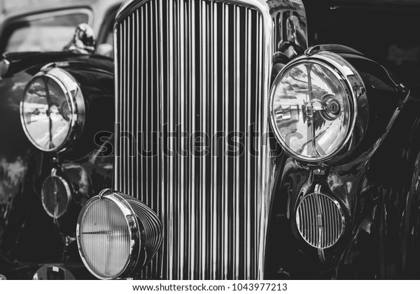 Front view of classic vintage car. Retro toned\
postcard, poster.