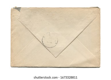 front view closeup of blank old aged closed letter paper envelope with torn edges and faded stamp print isolated on white background