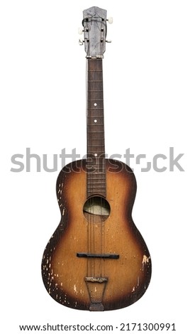 front view closeup of old brown grungy acoustic guitar with broken chords isolated, on white background