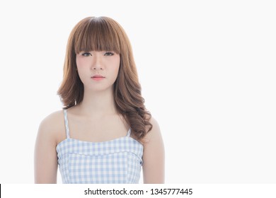 Front View Close-up Portrait Of Young Beautiful Asian Woman With Curly Long Dark Brown Hair In Light Blue Checked Dress Stand Up Straight And Looking At Camera On Isolated White Background