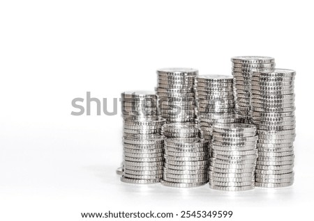 Front view columns of silver coins. Isolated on white. Idea of business and finance. Copy space