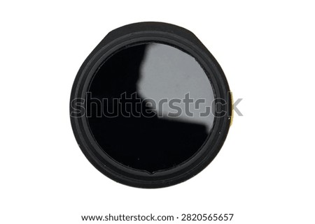Front view of a compact black wireless clip-on microphone transmitter for mobile recording and content creation, isolated on a white background.