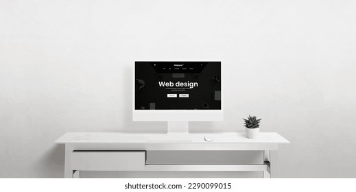 A front view of a computer display on an office desk featuring a minimalist workspace, highlighting web design, UX, UI, and digital rendering