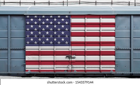 Front view of a container train freight car with a large metal lock with the national flag of USA.The concept of export-import,transportation, national delivery of goods and rail transportation