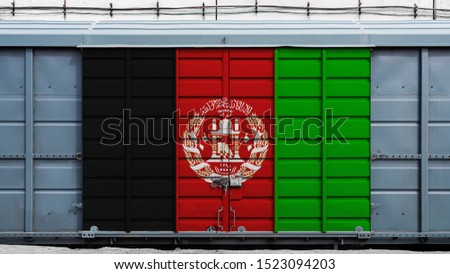 Front view of a container train freight car with a large metal lock with the national flag of Afghanistan.The concept  export-import,transportation, national delivery of goods and rail transportation