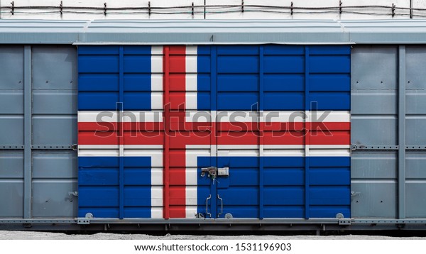 Front view of a container train freight\
car with a large metal lock with the national flag of Iceland.The\
concept of export-import,transportation, national delivery of goods\
and rail transportation