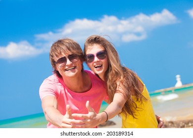 front view of couple having fun at beach