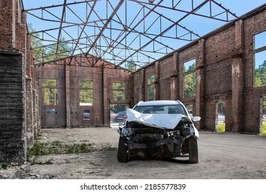 Front View Of A Crashed Car Wreck In A Vintage Workshop Garage With Copy Space