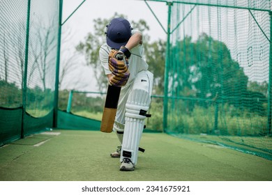 Front view of Cricket Batsman Action, Cricket game closeup player batting ball 