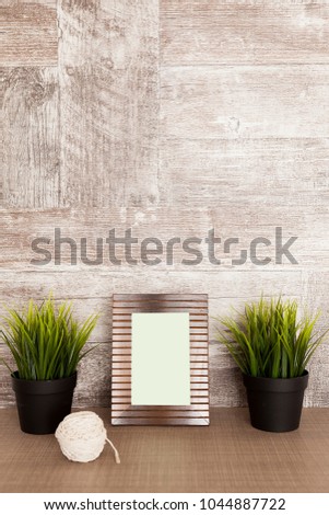 Front view of decorative old photo frame over wooden background