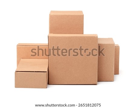 Front view of different blank brown cardboard boxes isolated on white
