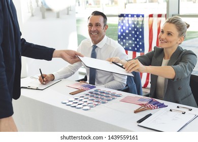 Front View Of Diverse Business People Sat Next To Desk And Smiling To Applicant 