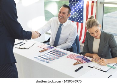 Front View Of Diverse Business People Sat Next To Desk And Smiling To Applicant 