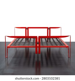 Front view of double bed, featuring a red enamelled metal frame and a bed base with straps.