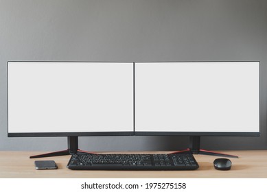 Front view of a double blank white display-There is a mobile phone, mouse, keyboard, devices for working during the coronavirus