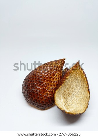 Front view of an empty peeled snake fruit shell showing its scaly texture, isolated on a white background with copy space