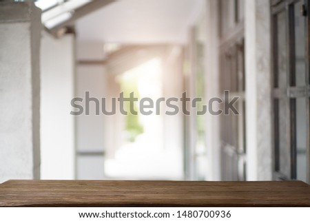 Front view of Empty Space on the brown wooden table for graphics display montage on background blur with bokeh Image for your photomontage or product display.