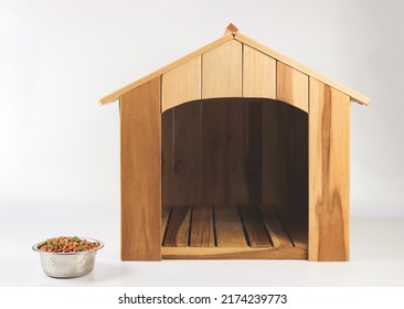 Front View Of Empty Wooden Dog's House With Dog Food Bowl  On White Background. Isolated.