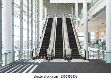 Front View Of Escalators In An Empty Modern Office Building