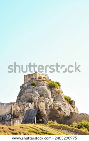 front view, far distance, stone fortress  midevil, ramming weapon