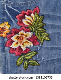 Front View Floral Embroidered Pattern Blue Jeans Denim Texture 


