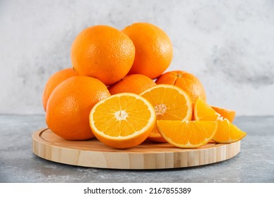 front view fresh sliced orange on dark background ripe mellow fruit juice color citrus tree citrus, Whole and sliced ripe oranges placed on marble background, half orange fruit. - Shutterstock ID 2167855389