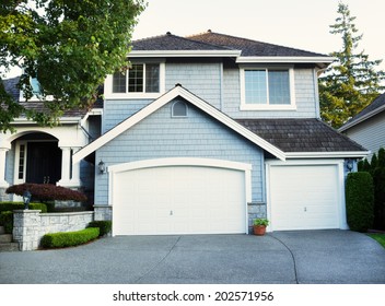 Front View Of Freshly Painted Home In Summer During Evening Time