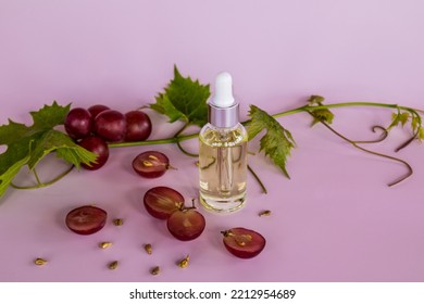 Front View Of A Glass Bottle With Cosmetic Organic Facial Skin Care Product Based On Grape Seeds. Elixir Of Youth